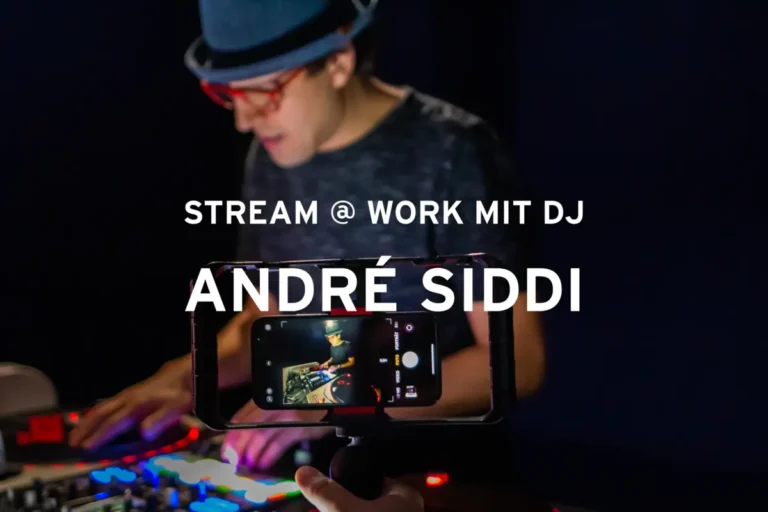 DJ André Siddi live beim Streaming mit Smartphone-Aufnahme und moderner Musik-Performance.